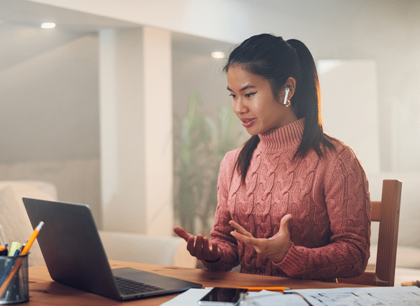 Business executive analyzing enterprise PBX performance and call flow charts on Phoneserv's scalable VoIP system dashboard